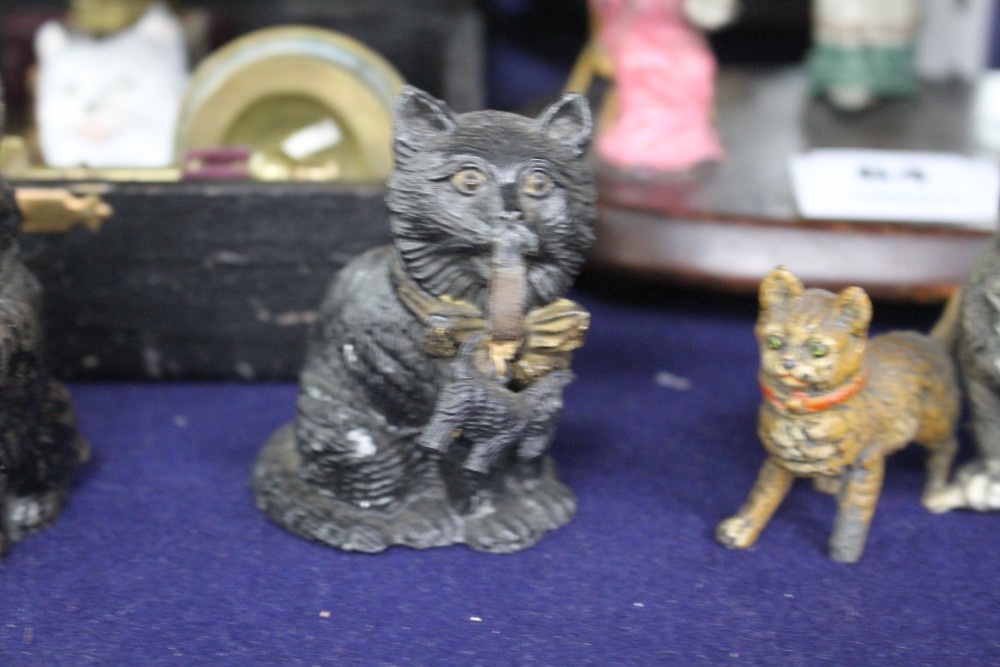 A group of assorted ornaments all relating to cats, comprising: boxed four piece desk set, a painted spelter three cat ornament, two fu